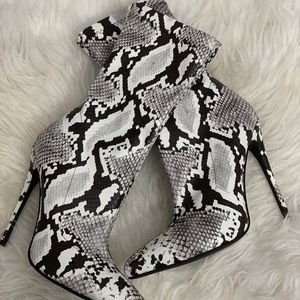 Simmi snake print high heel booties.